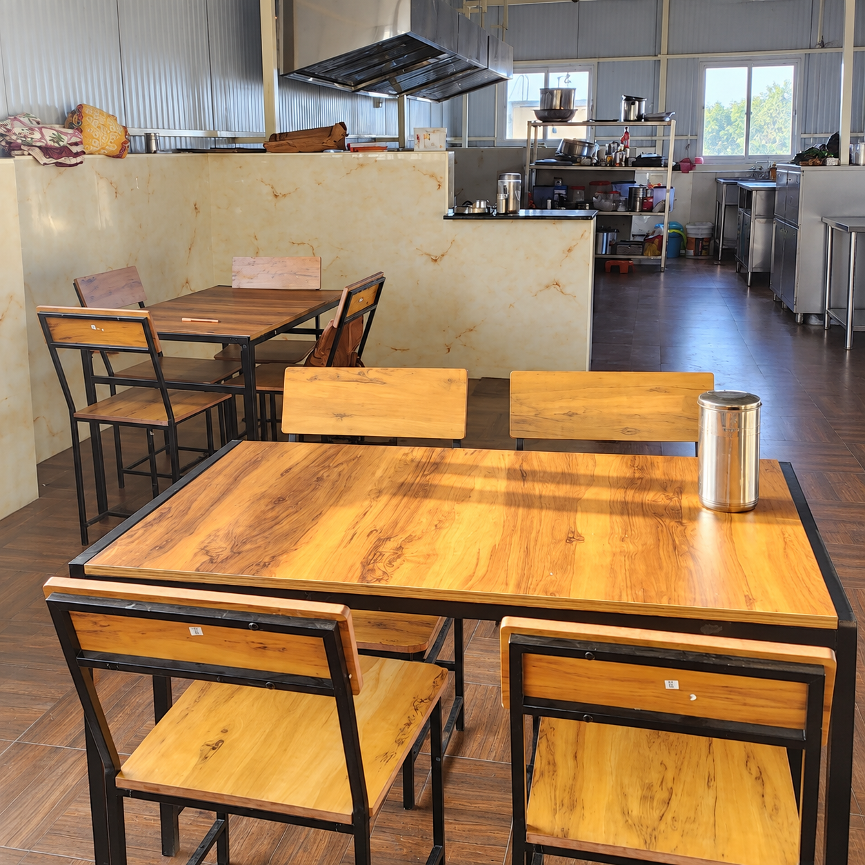 Oasis Living kitchen and dining area with wooden tables