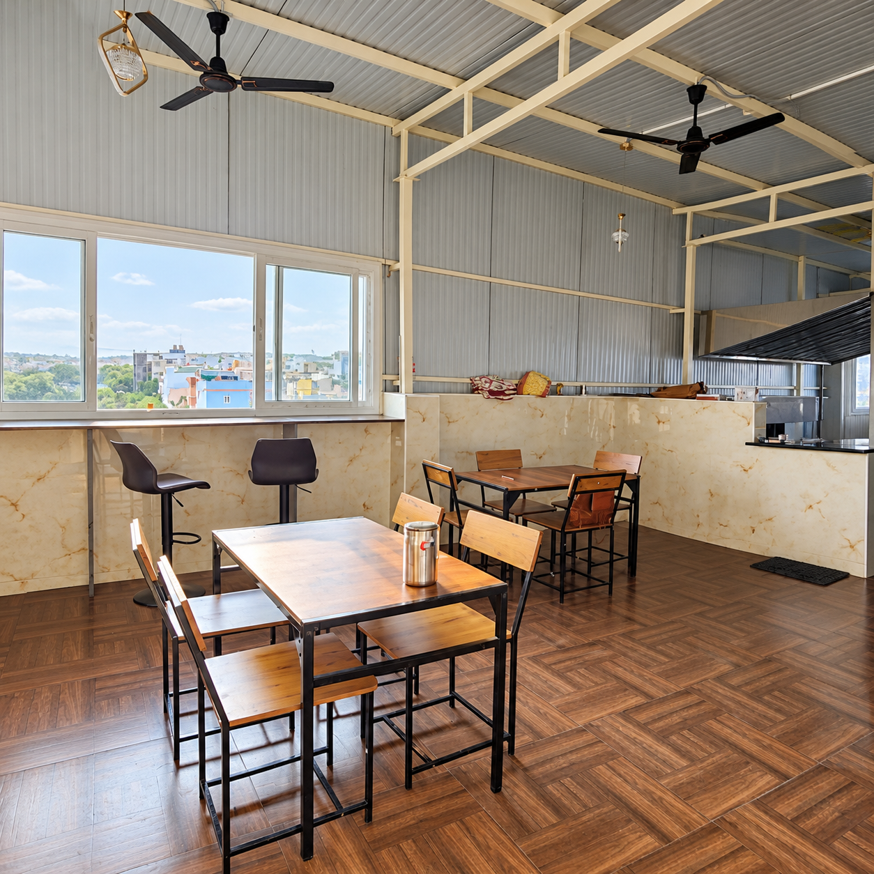 Oasis Living kitchen and dining area with tables and large windows