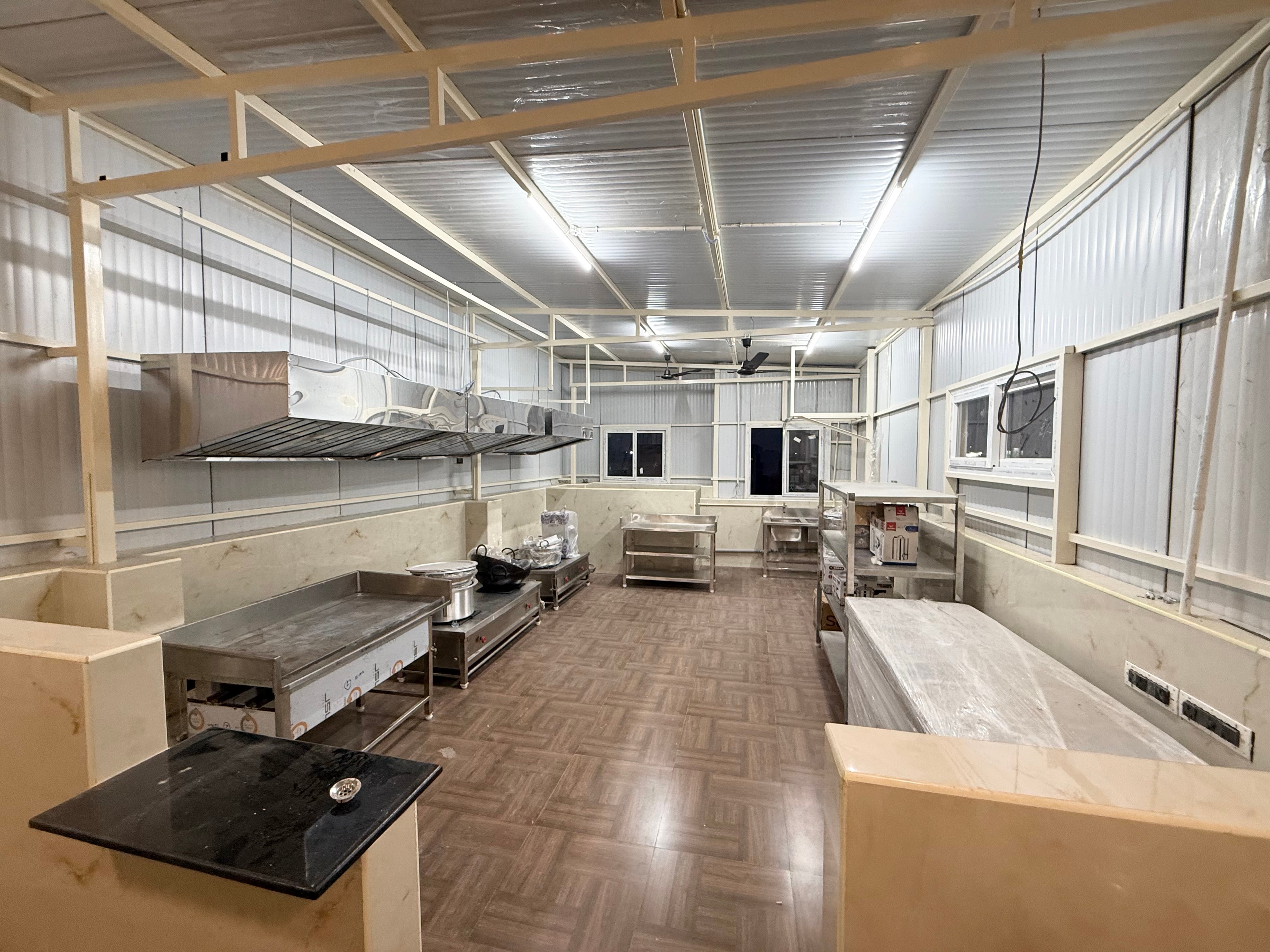 Well-lit shared kitchen at Oasis Living
