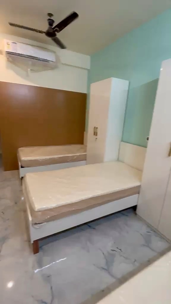 Triple sharing room — bedroom overview with AC