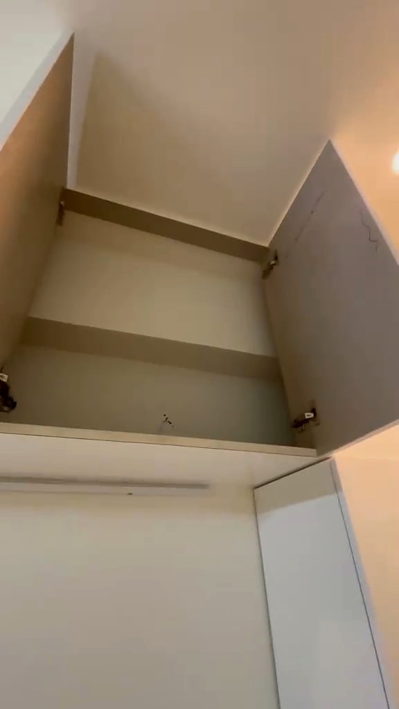 Triple sharing room — upper storage shelves