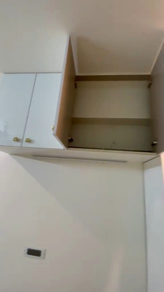 Triple sharing room — open shelves and cabinets