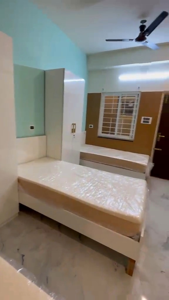 Triple sharing — bedroom reverse view